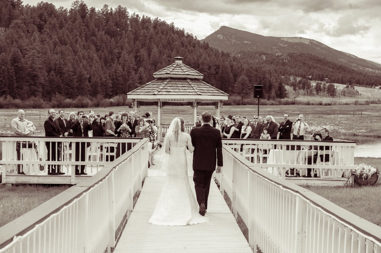 Chris & Laura's wedding in Greeley, Colorado - Bride walking down the aisle