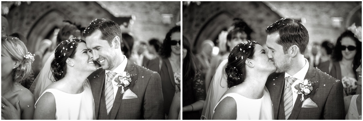 black and white image of wedding couple kissing