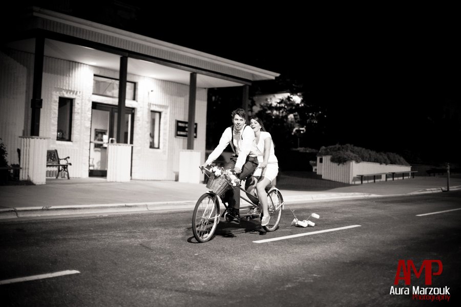 Bicycle ride at the end of this Winston Salem wedding. Winston Salem wedding photographer by Aura Marzouk Photography.