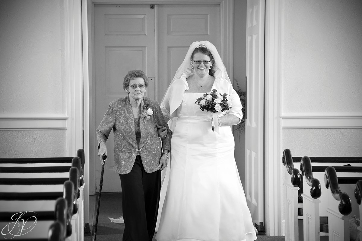 bride and mother photo, bride walking mother, wedding ceremony photo, Wedding at The Queensbury Hotel, Lake George Wedding Photographer