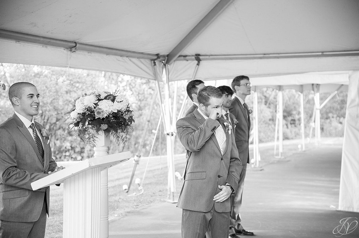 groom seeing bride for first time at ceremony