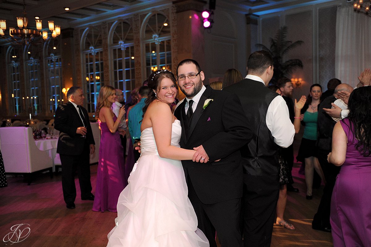 photo of bride and groom dancing at their recpetion