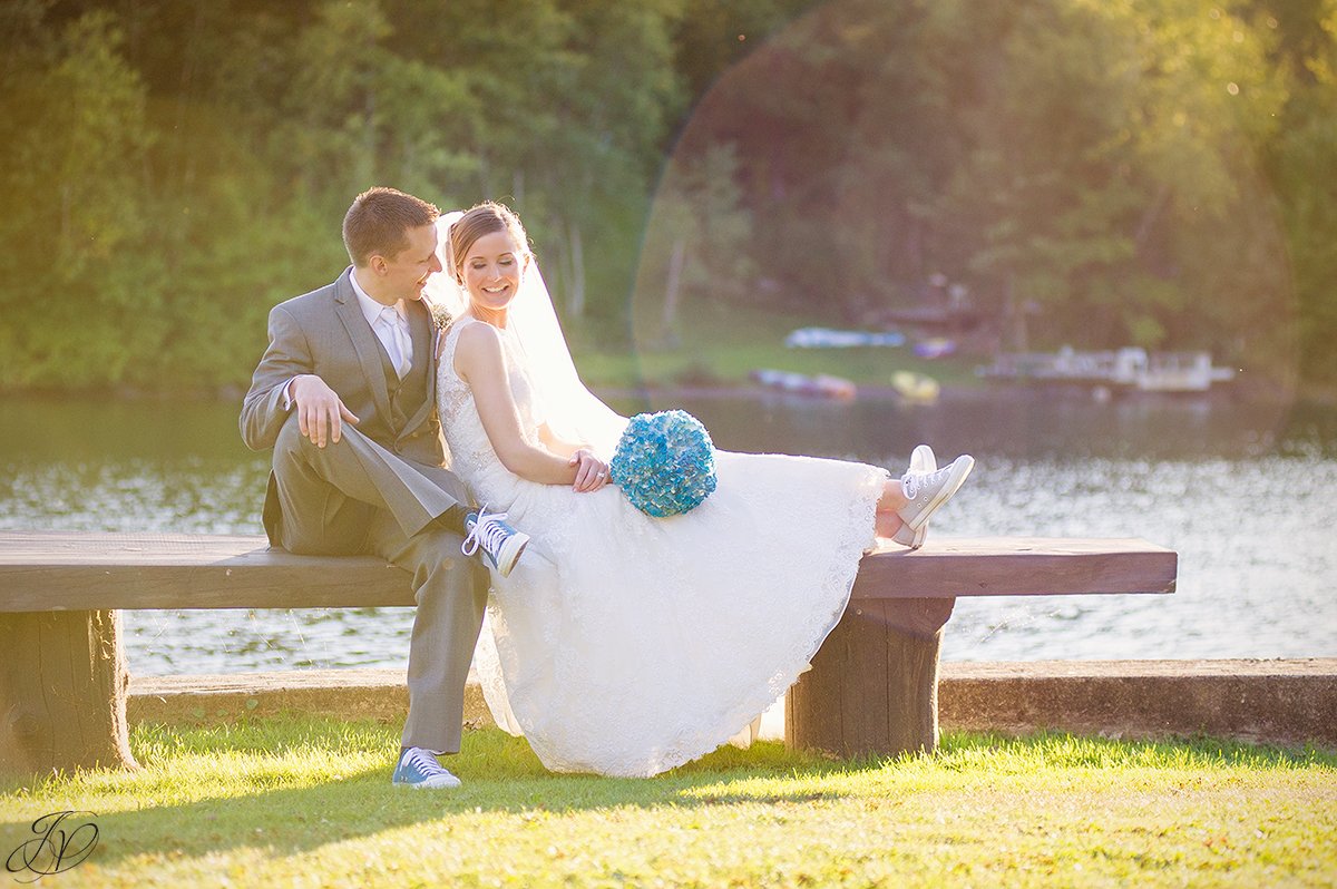 beautiful image of bride and groom during sunset on a lake