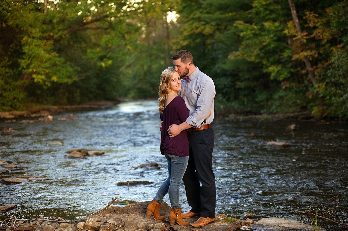 romantic couple portrait fall water saratoga springs head kiss