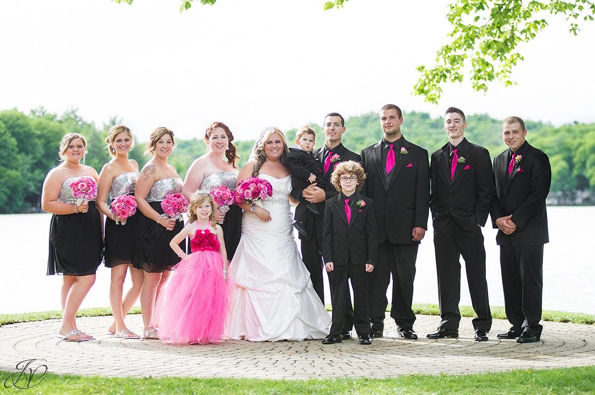 wedding party photo in front of a lake