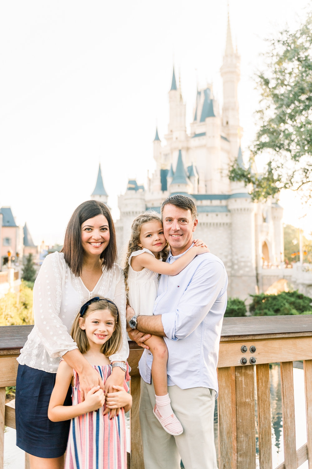 smiling family at Disney Magic Kingdom, Fantasyland, Walt Disney World