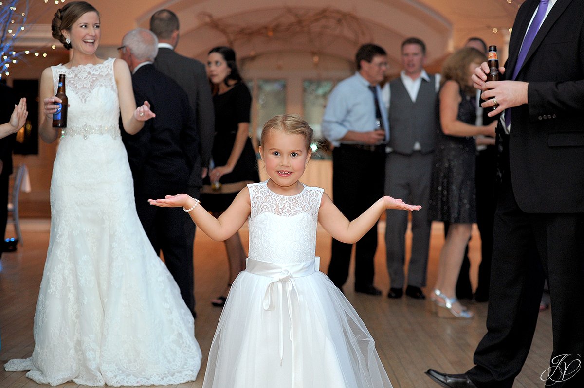 adorable flower girl dancing at reception