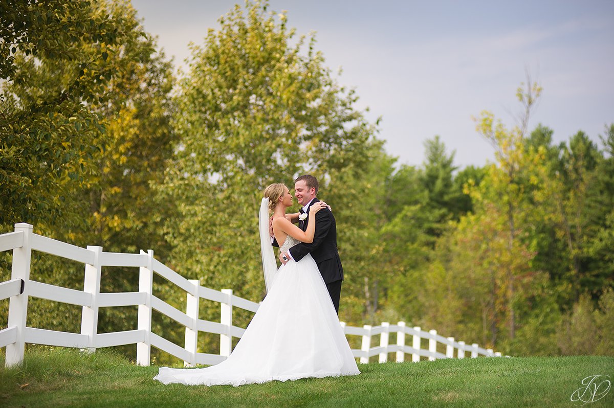 bride and groom white fence saratoga national