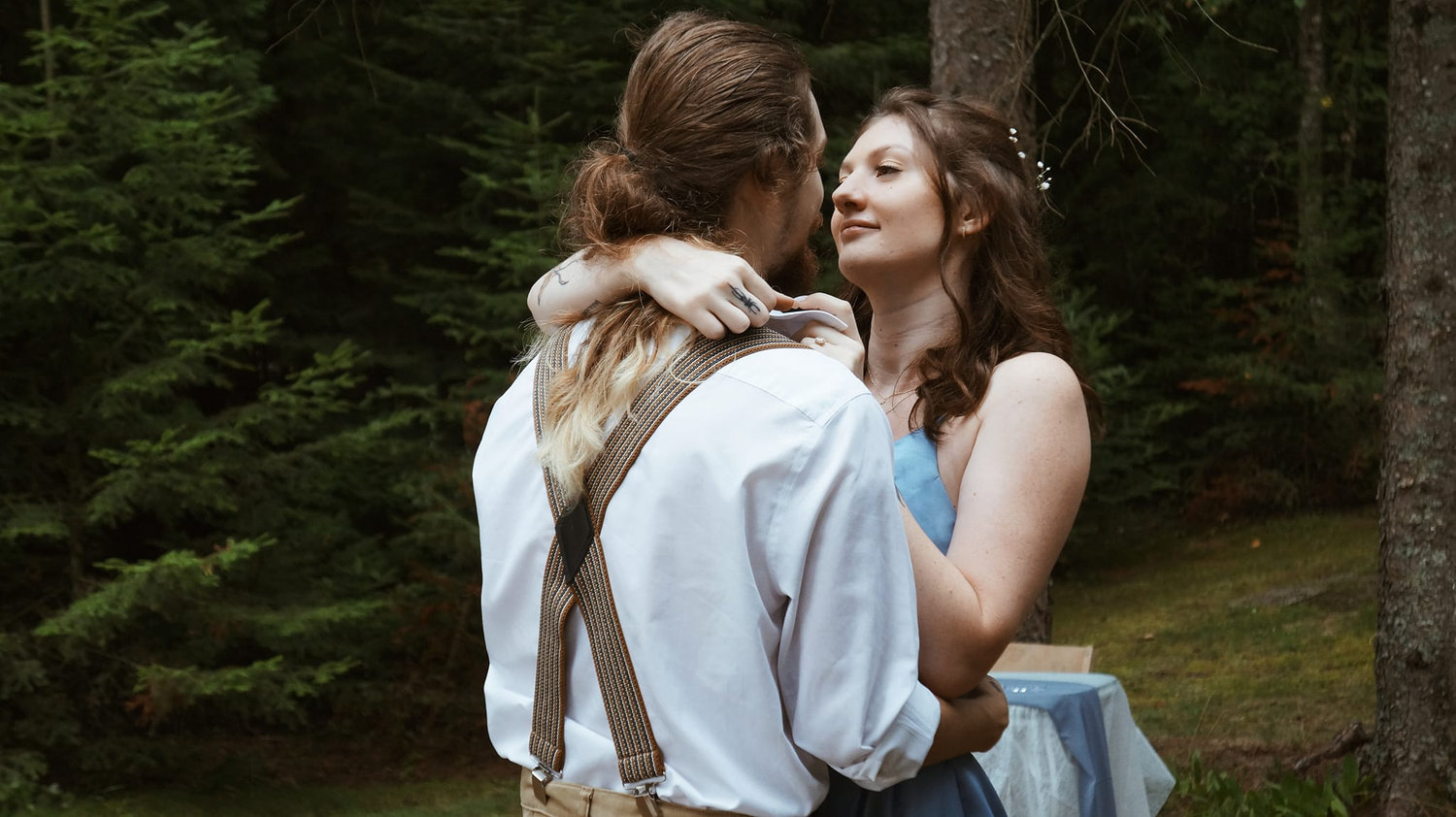 Couple embracing in a forest