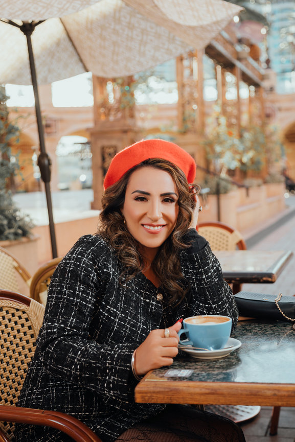 Fancy french styled portrait in Tivoli Village with coffee and french inspired wardrobe, portrait picture taken by Adam Trujillo, a Las Vegas portrait photographer.