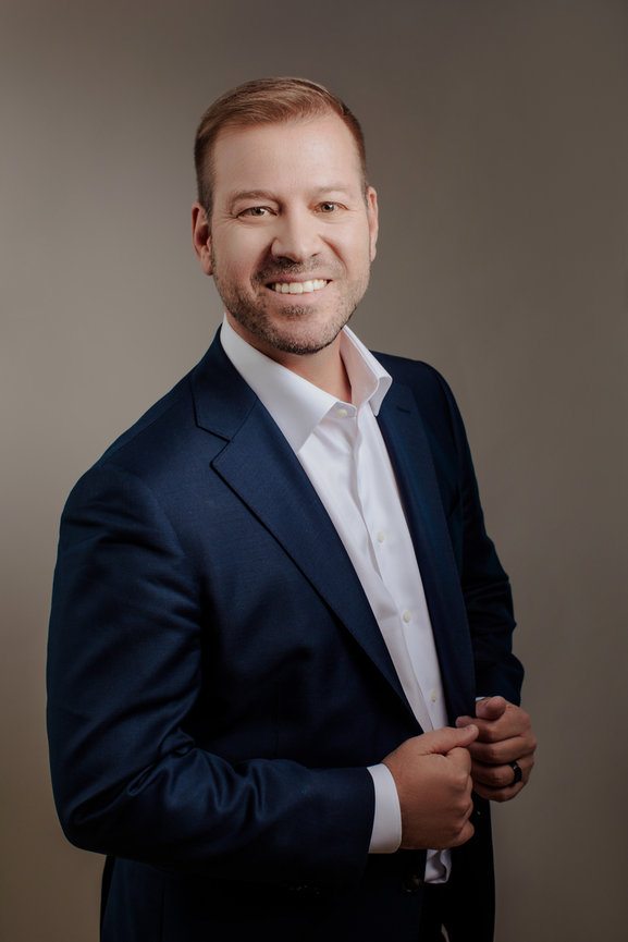 Mens professional headshots in Las Vegas for buisness in sharp blue suit and white button up. Las Vegas professional headshots and team headshots in studio with Adam Trujillo.
