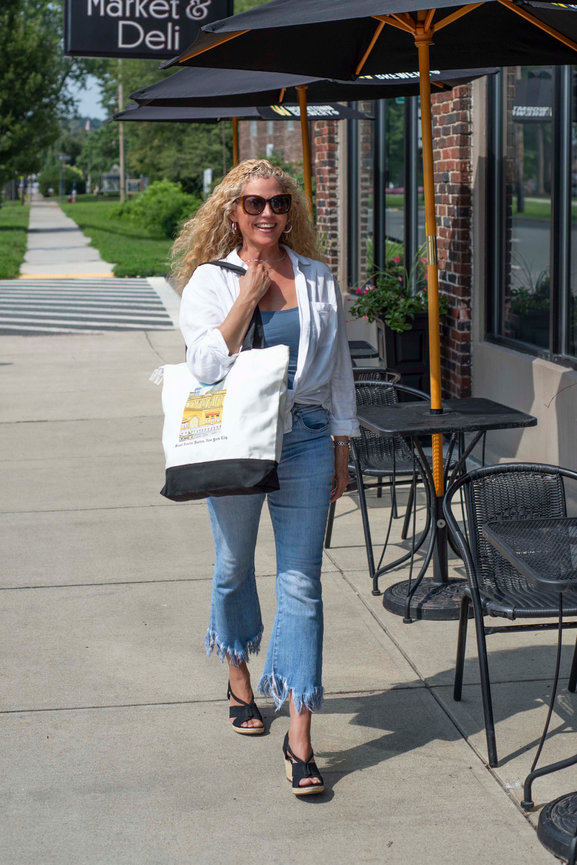 Woman walking with a tote bag