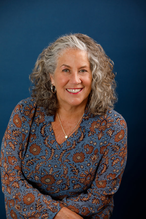 casual headshot for a mature woman with beautiful silver curls