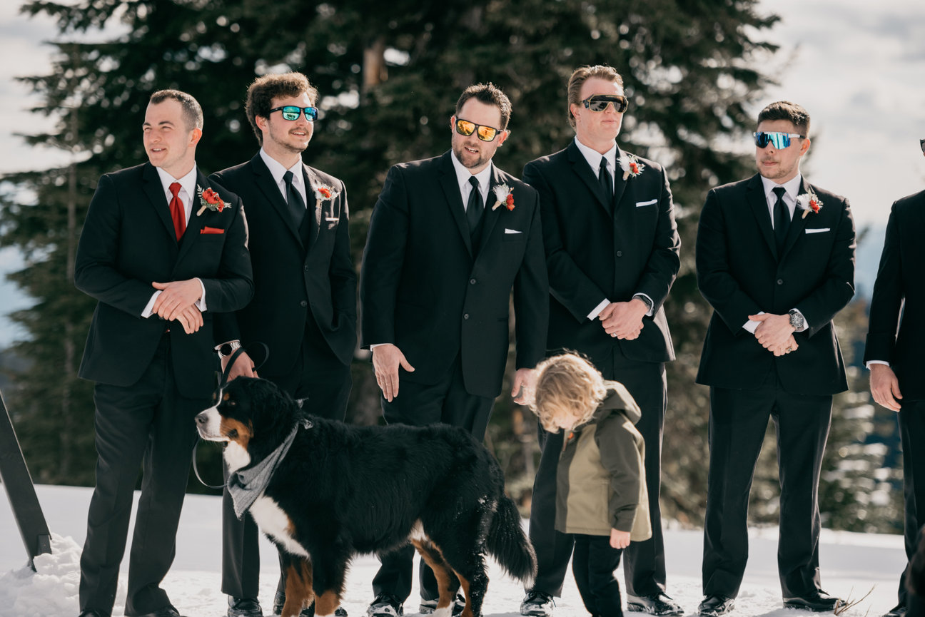 Groomsman portrait: Groom smiles confidently in an outdoor setting, captured during pre-ceremony preparations by a wedding photographer in Kelowna.