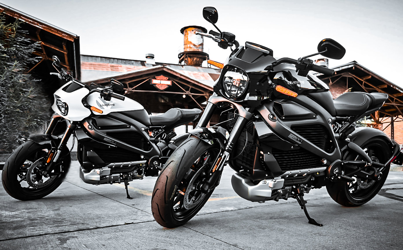 Close-up of two Harley-Davidson LiveWire electric motorcycles with a sleek white and black design, emphasizing the front headlight and bold tire details. Captured by Tre Nelson Photo at Summit Harley-Davidson in Vineyard, Utah.