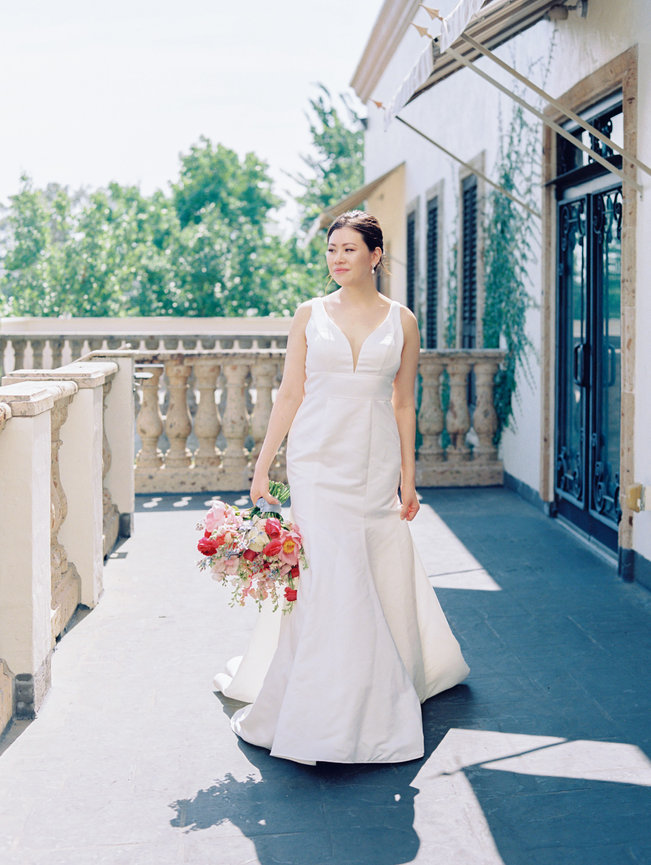 Bride holding her bouquet in the balcony of a houston event venue