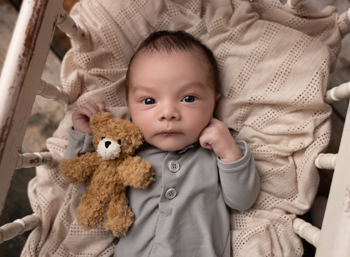 In home newborn session baby boy in crib Brownsville, TX