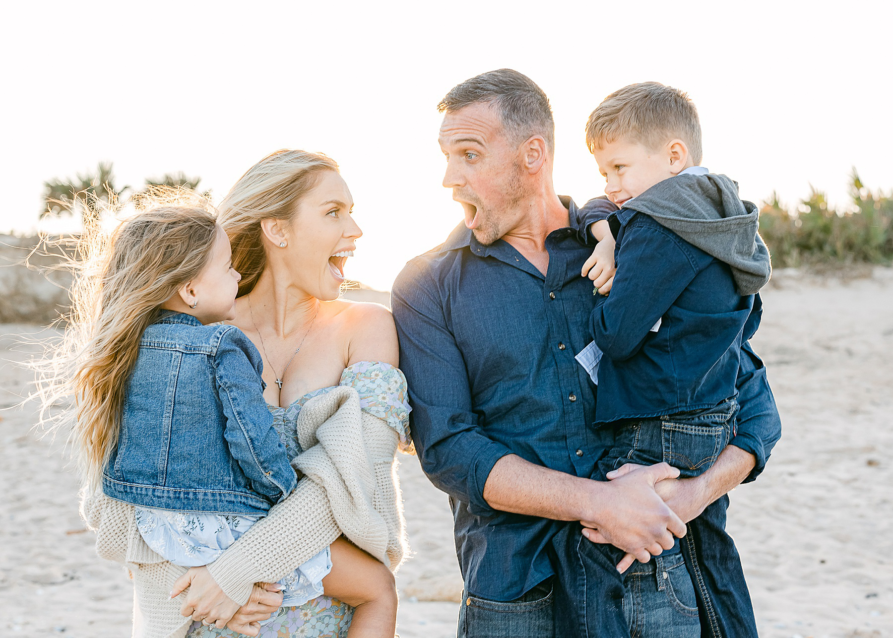 family beach photo session in saint augustine beach at sunset