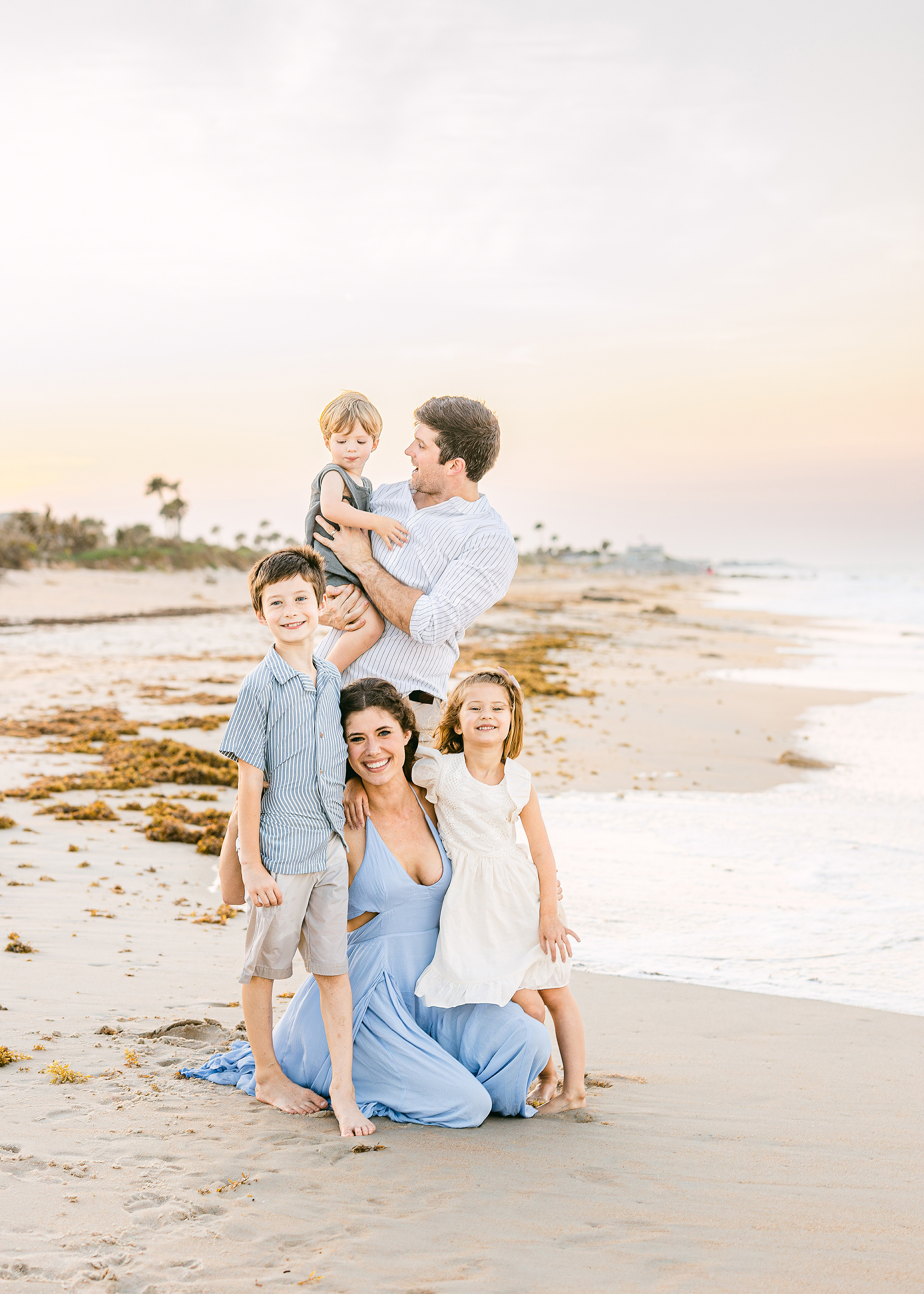 pastel family beach portrait at sunset