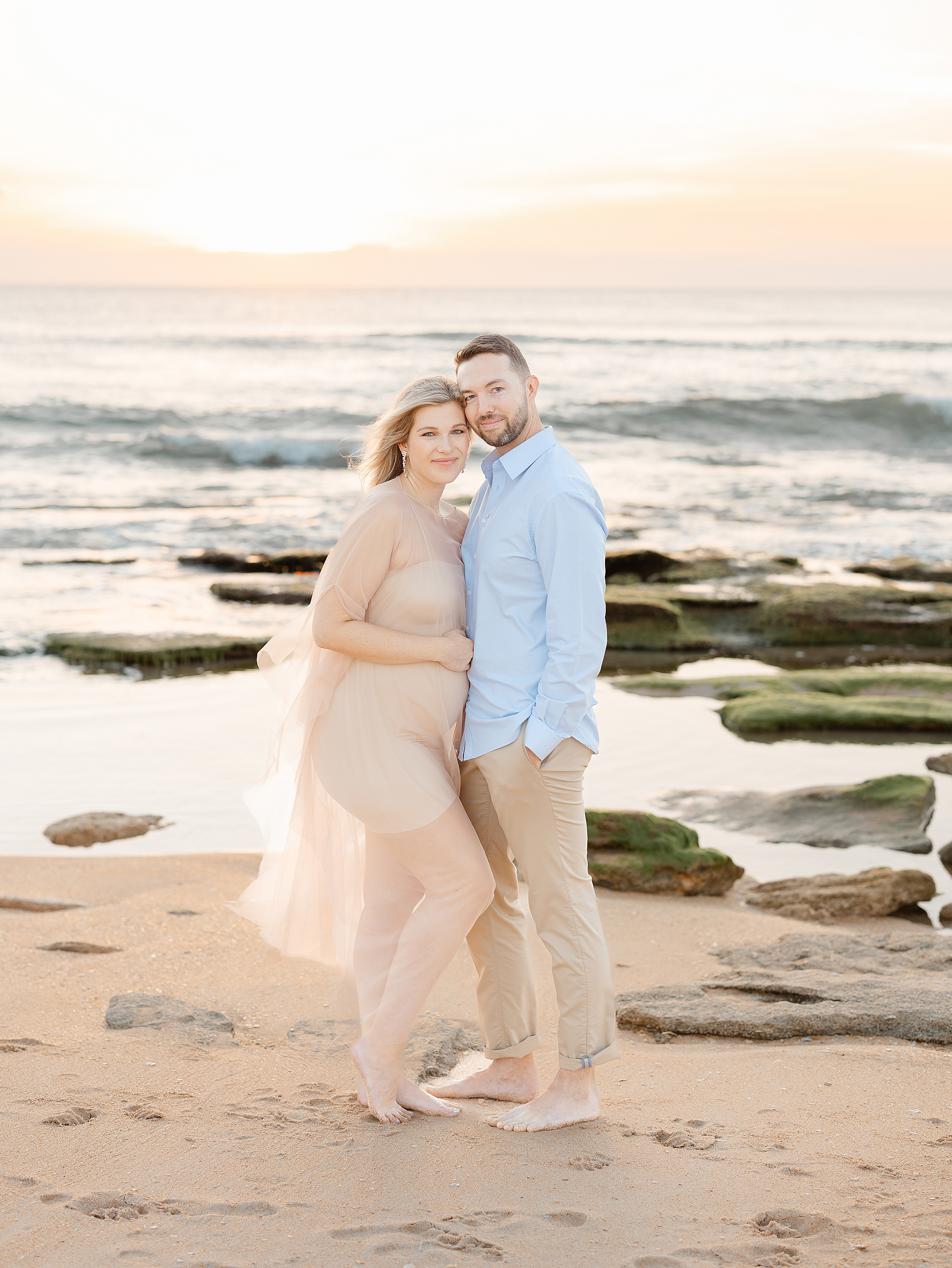 St. Augustine Beach sunrise coastal maternity session with a light and airy theme.