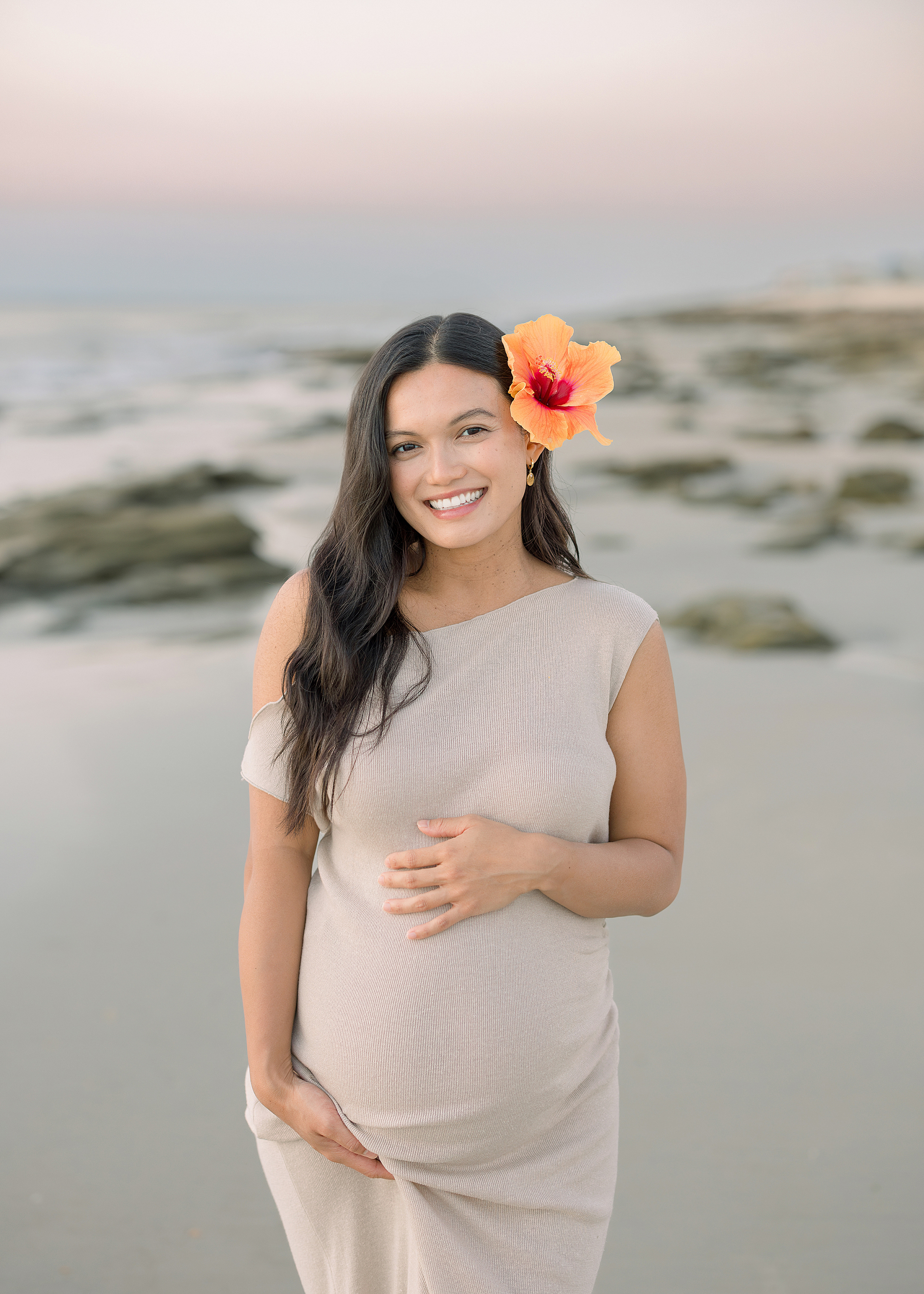 Sunrise maternity pregnancy portrait of a Jacksonville woman on St. Augustine Beach at sunrise.