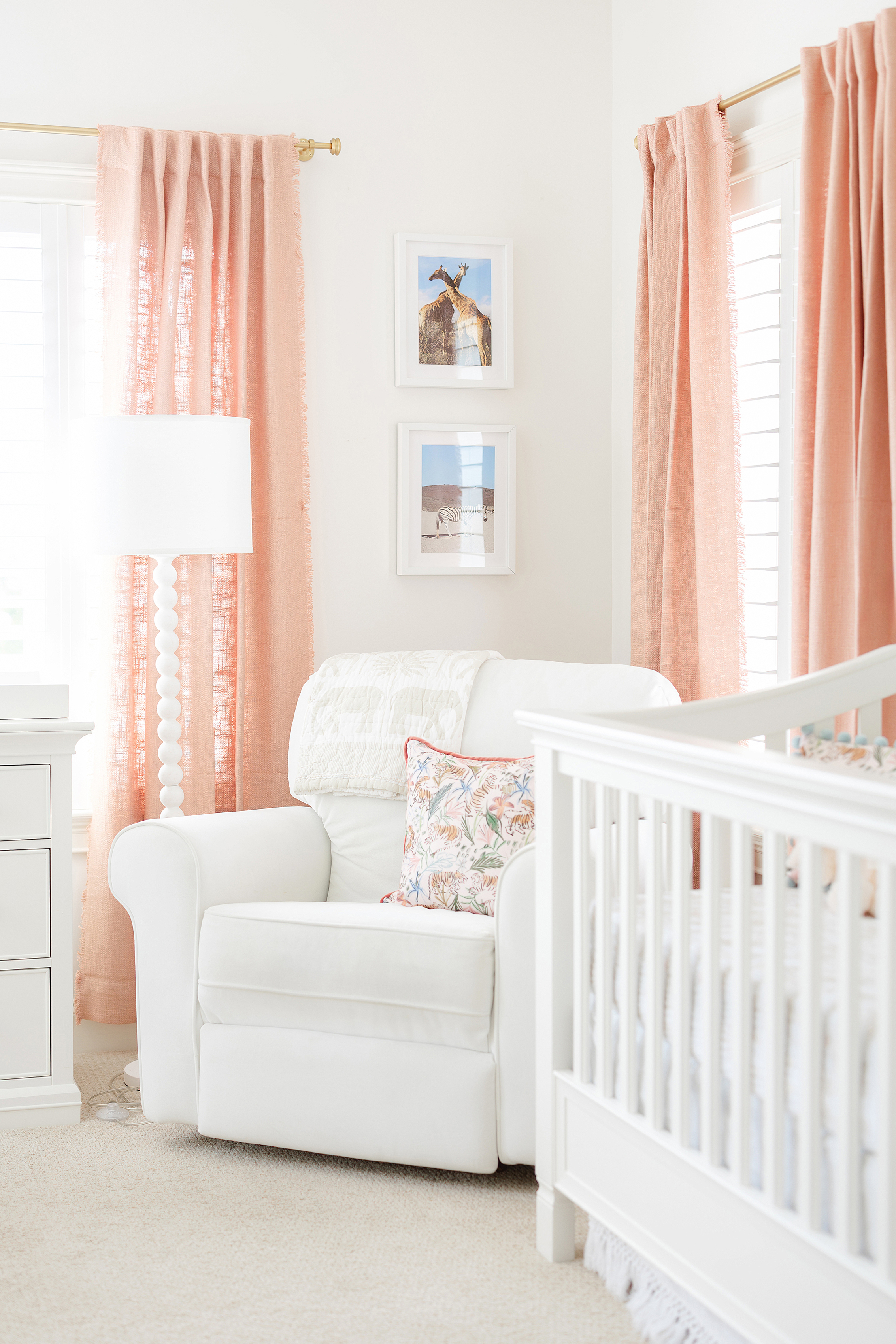 A newborn girl's pink and white safari themed nursery in Ponte Vedra Beach.