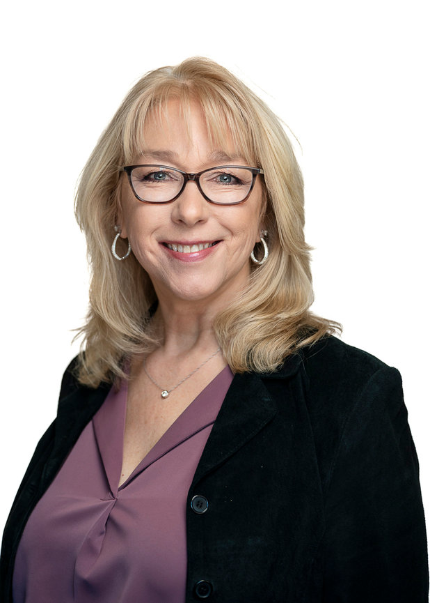 Female headshot on white backdrop.