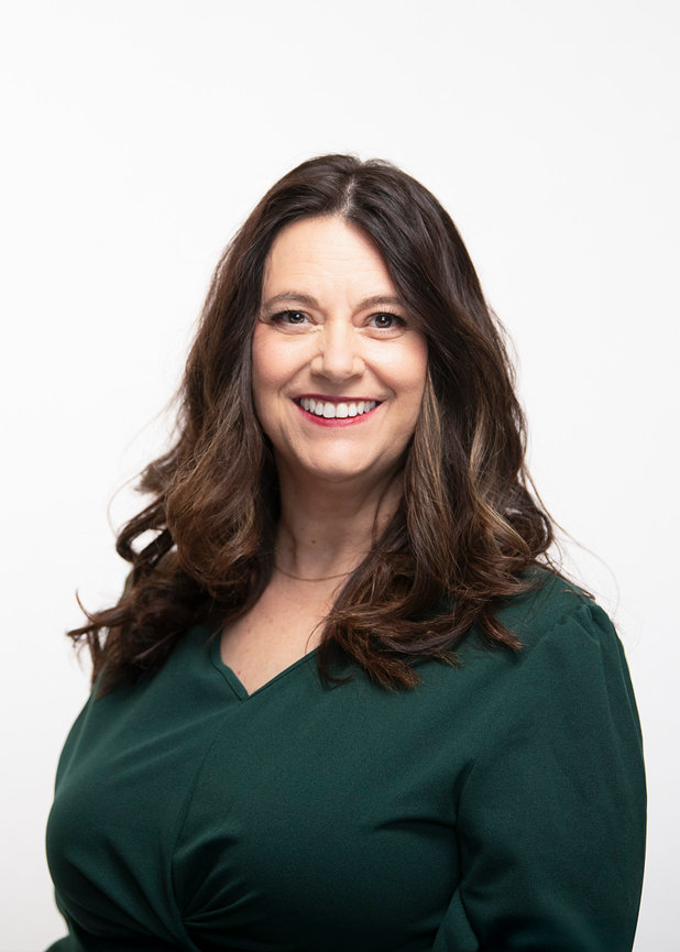 Female headshot on white backdrop.