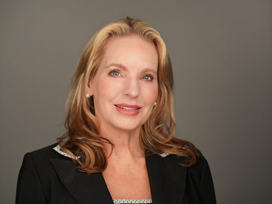 Executive-style professional headshot with studio lighting used for LinkedIn and corporate branding