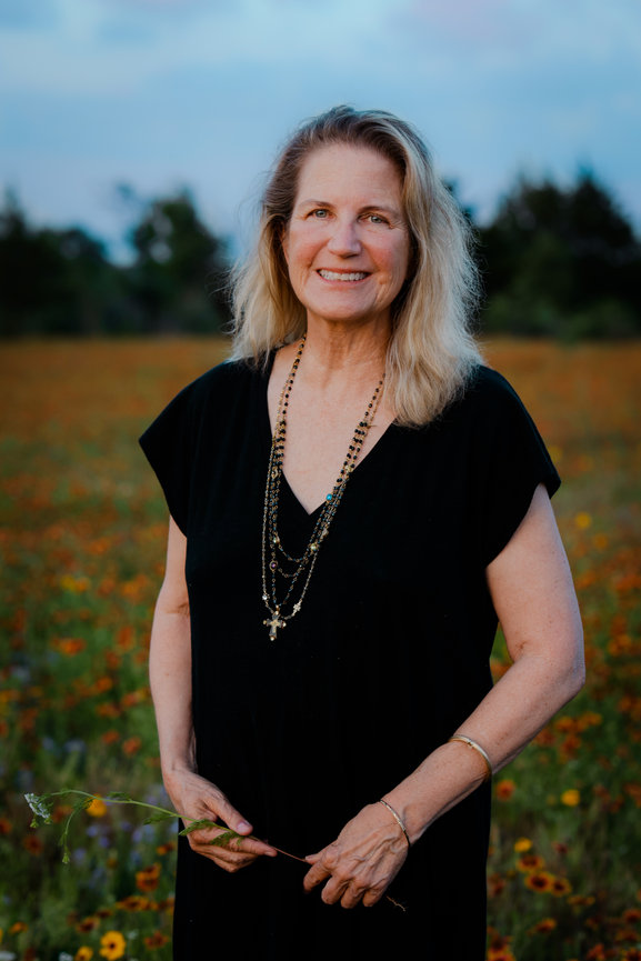 Aging gracefully and embracing her beauty in a field of wildflowers in Fort Wroth, TX