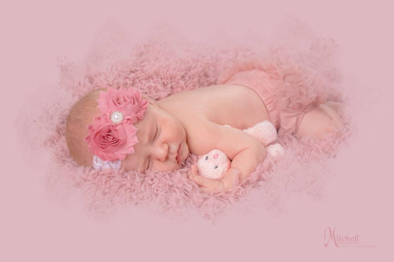 newborn baby girl with baby bear