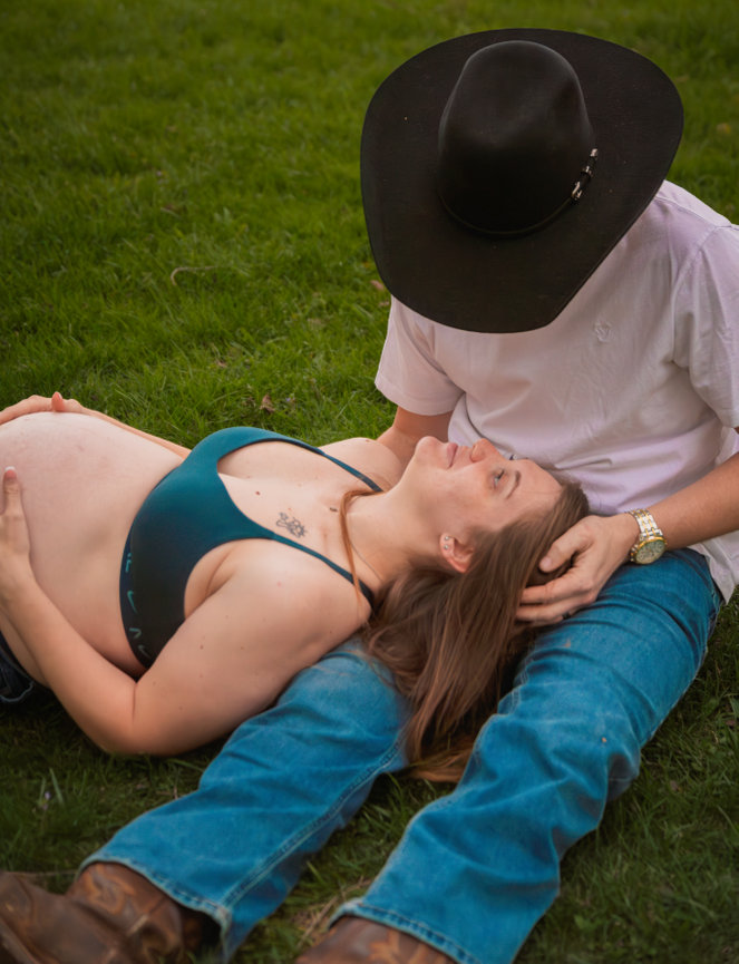 Man and woman lying on grass in a park