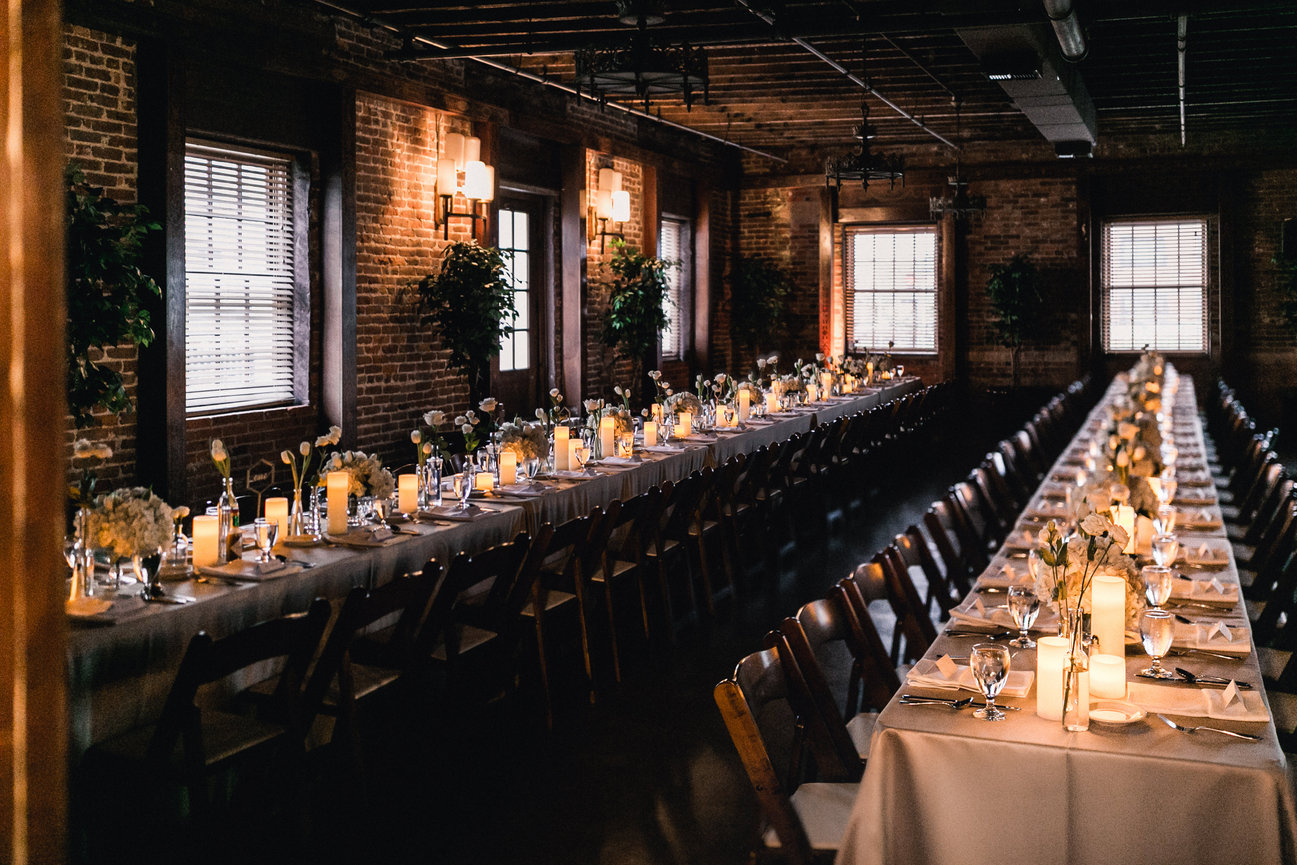 Long table setup with candles and flowers
