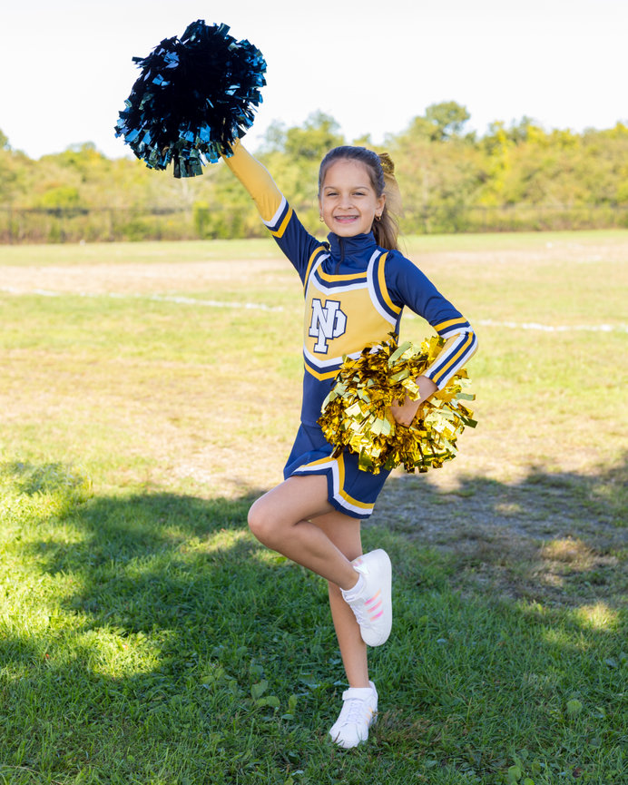A woman in a cheerleader outfit posing for a picture photo – Free Poland  Image on Unsplash