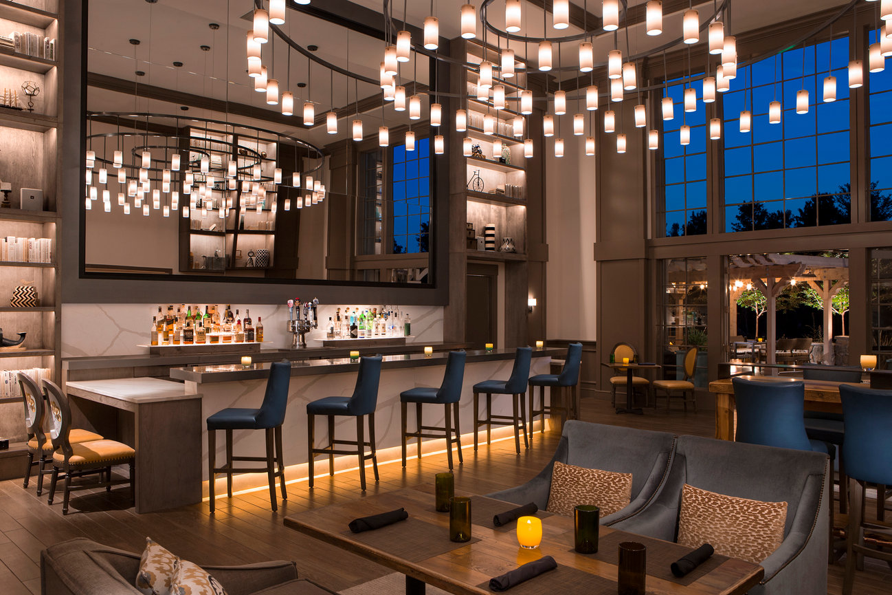 River Terrace Hotel Dining Room in Napa Valley with modern architecture and a hand made large chandelier overlooking a beautiful patio in Napa Valley.