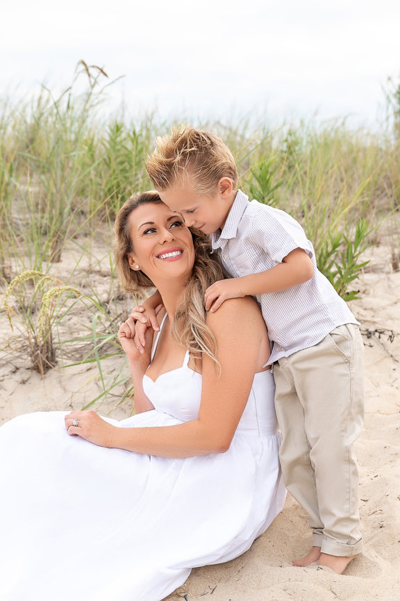 Mother and son hugging on a quiet Monmouth County beach path