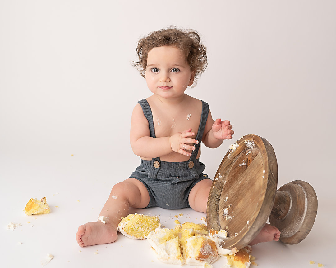 Artistic overhead shot of cake smash mess photographed in Middletown, NJ and joyful baby