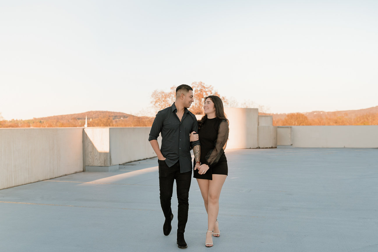 Couple walking together on a rooftop