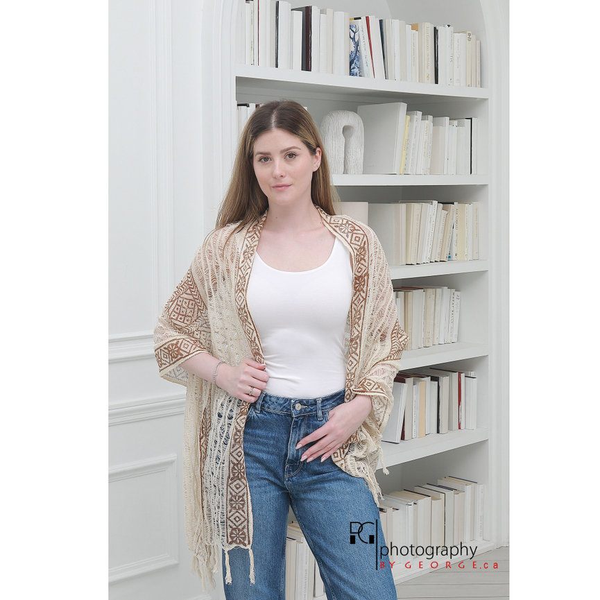 Model wearing a boho crochet wrap with fringe detailing, highlighting Summer 2026 bohemian fashion trends.