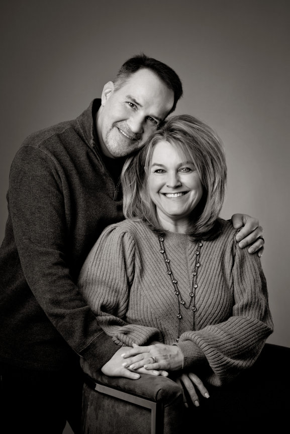 A black and white portrait of an older couple celebrating their 25th anniversary.