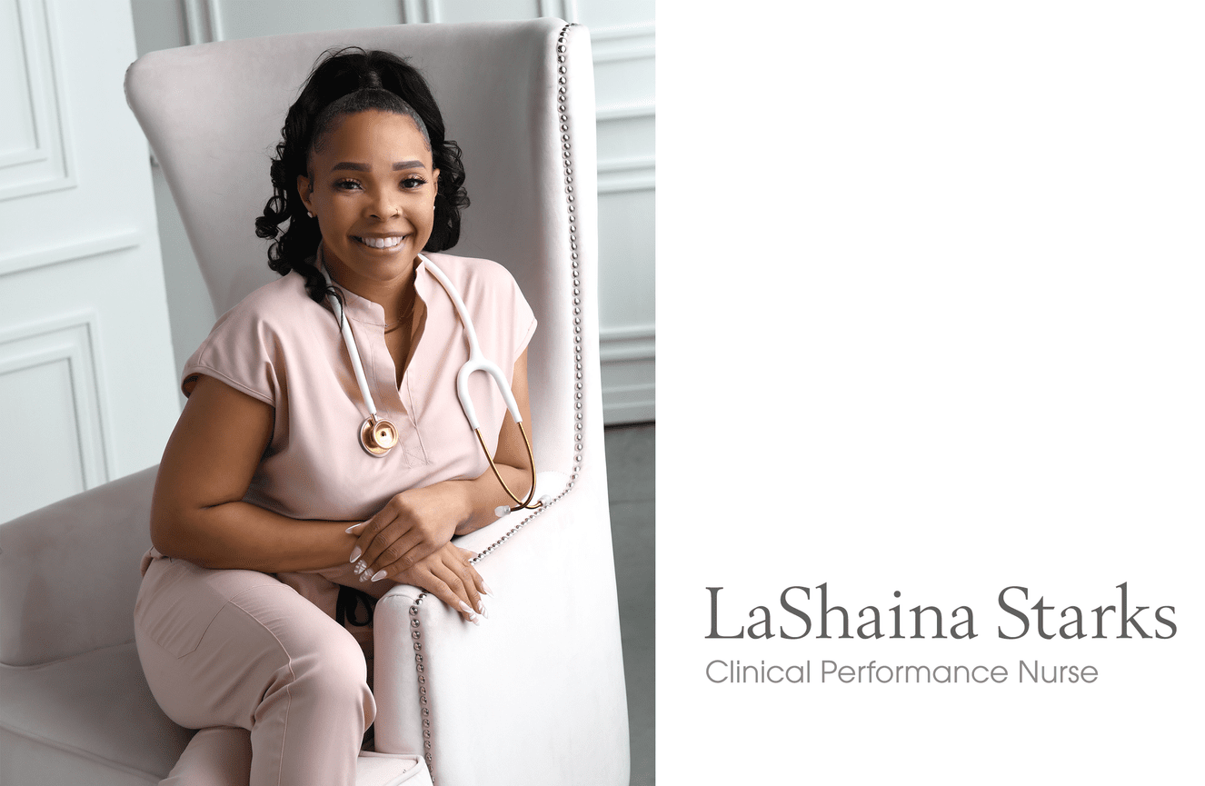 A professional photo of LaShaina, a clinical performance nurse, sitting in a pink chair wearing pink medical scrubs and a stethoscope.