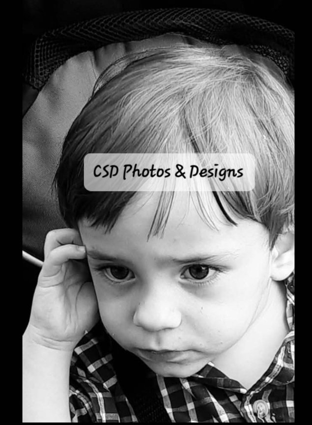 Black and white portrait of a toddler looking thoughtful