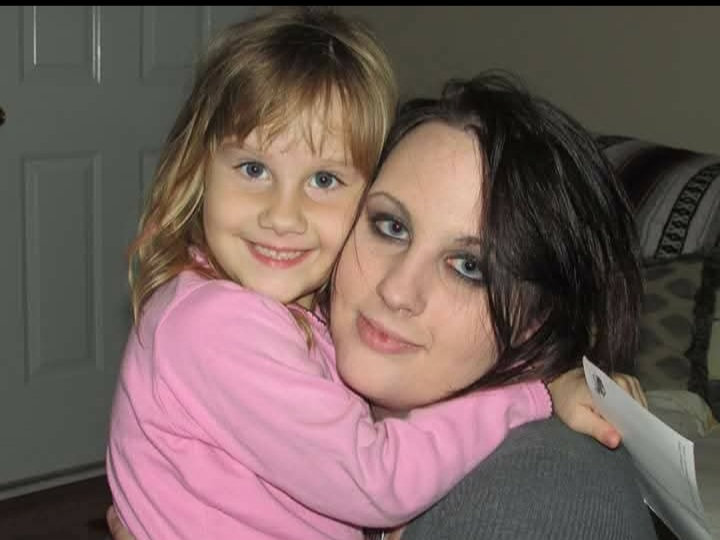 Mother and daughter sharing a hug at home