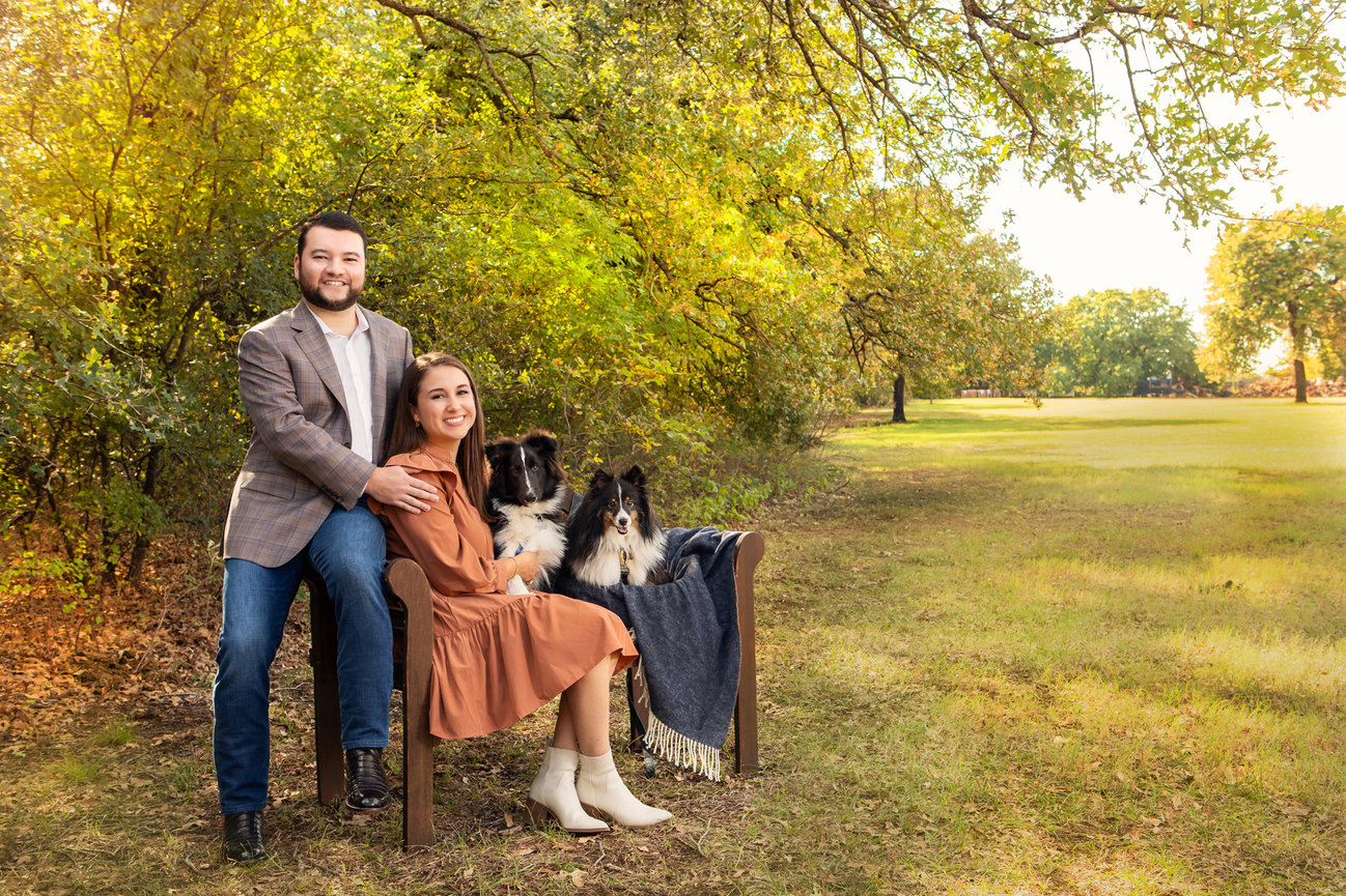 Engagement photo session of a couple and their dogs.