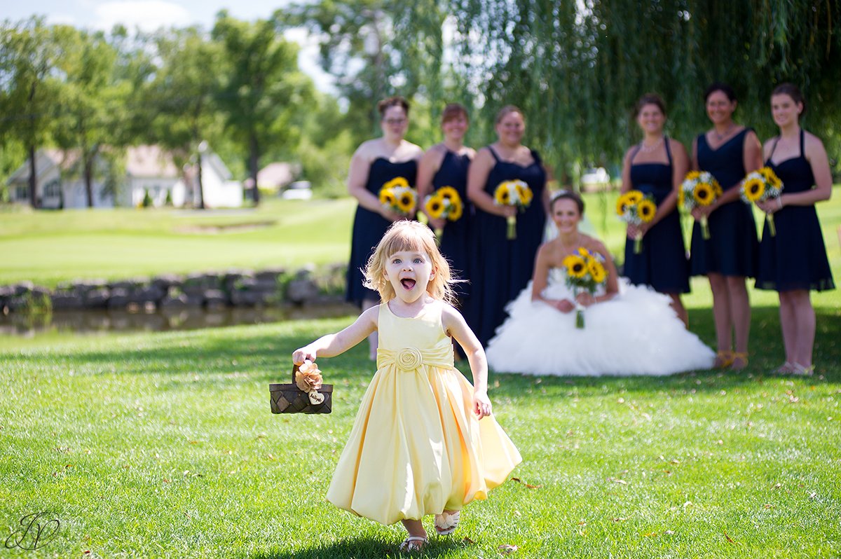 bridesmaids in dark blue with sunflowers